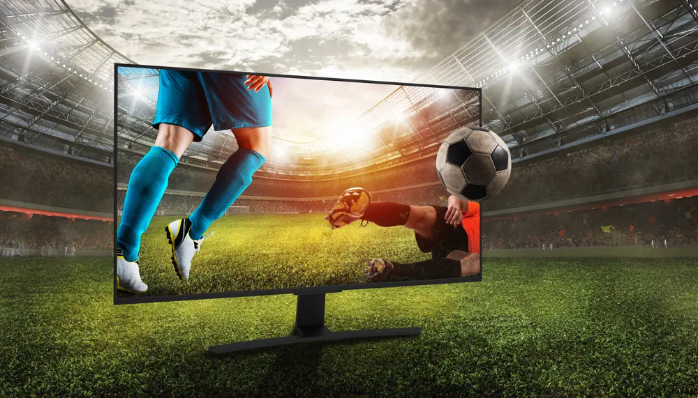 Streaming av fotboll - TV med fotbollsplan i bakgrunden